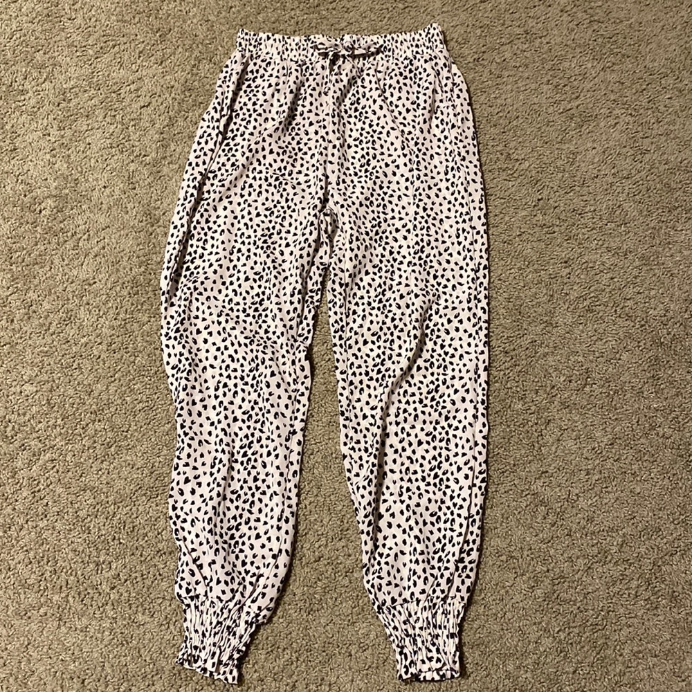 Leopard print joggers with pockets.
